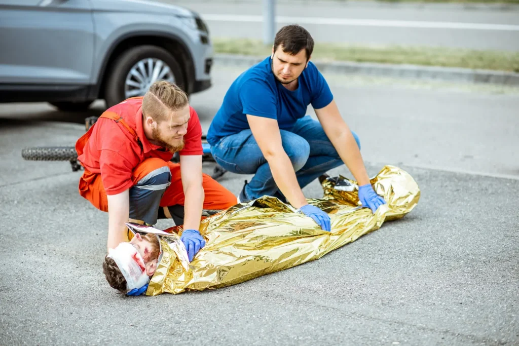 Emergency first aid training at a simulated road accident scene