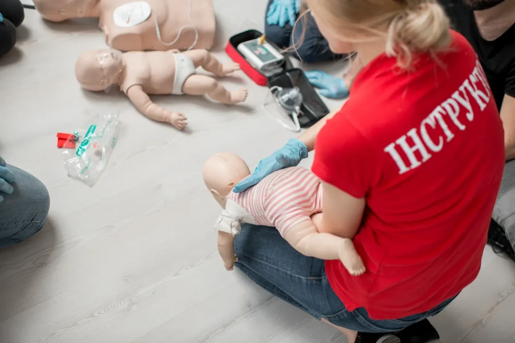 First aid students preparing emergency response equipment during training