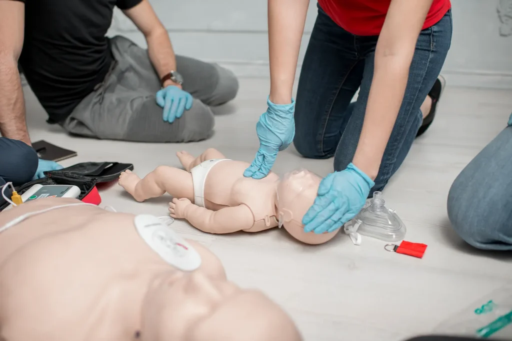 Infant CPR and rescue breathing training on baby manikin